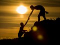 Silhouette of  helping hand of a friend.